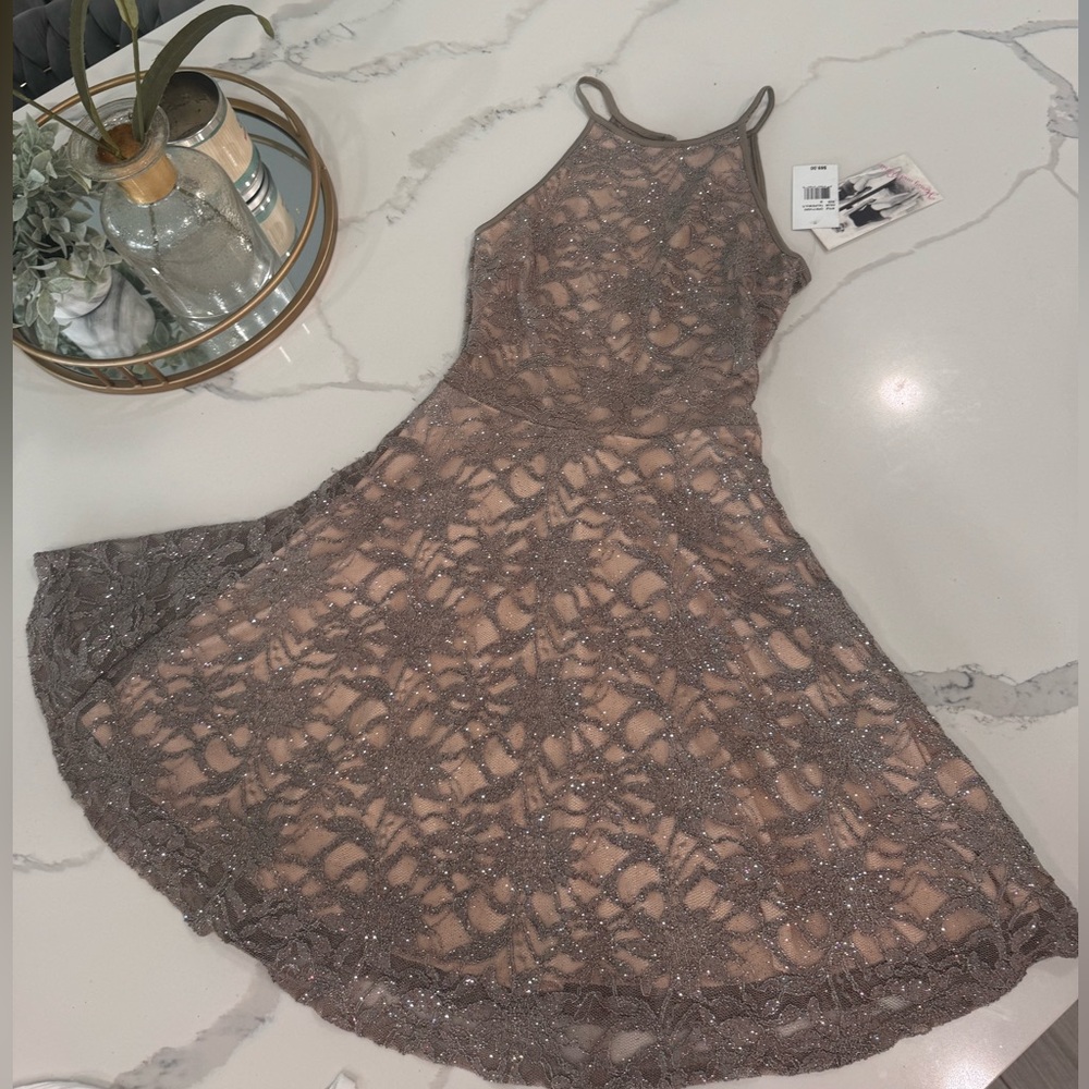 Elegant Lace High Neckline Dress from Dillard’s.
